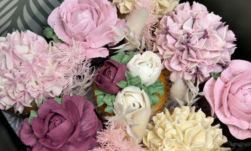 Buttercream flower cupcakes piped like roses and hydrangeas by JJ Bakes